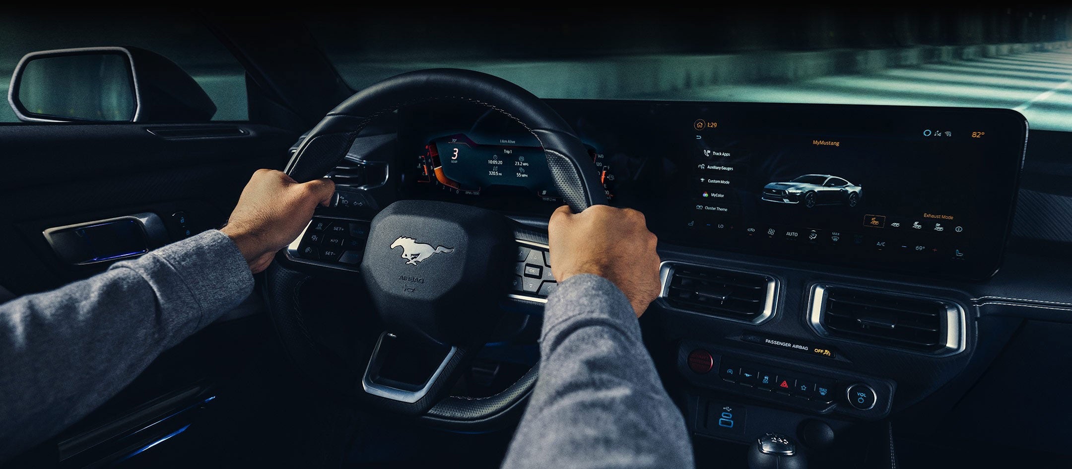A 2024 Ford Mustang® model interior with a person driving | O'Rourke Motors Inc in Tipton IA